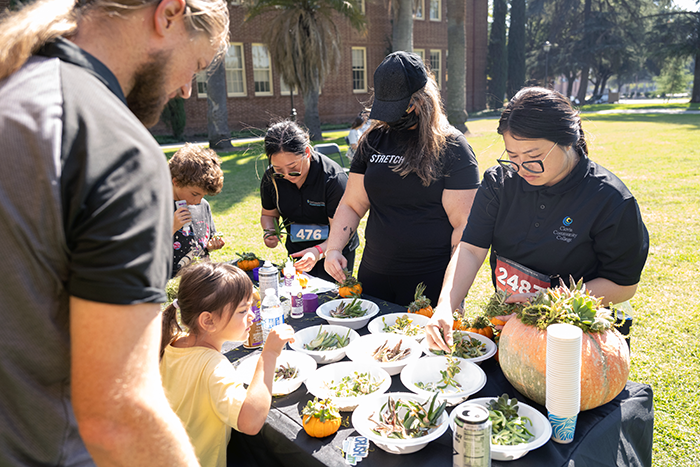 People making succulent pumpkins at a Parkinson's benefit walk in Fresno